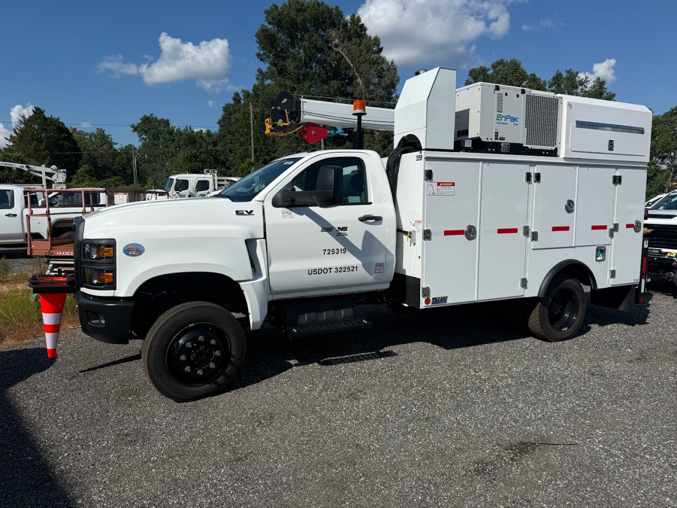 Medium-duty service truck with crane and EnPak equipment